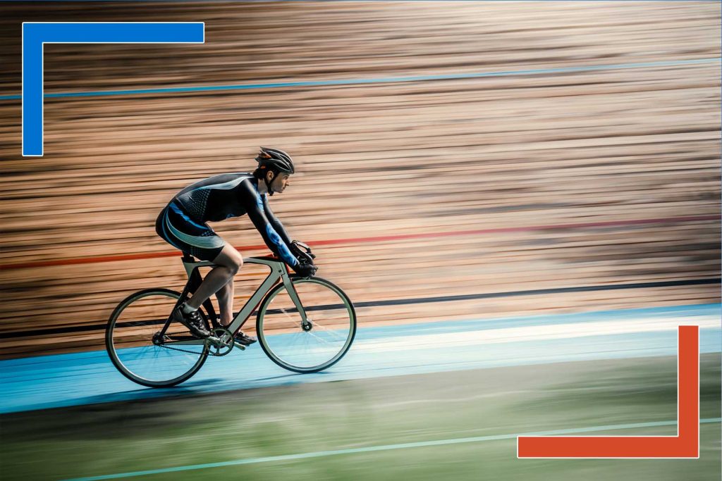 Cyclist racing on track symbolizing speed, agility, and automation in enterprise DataOps