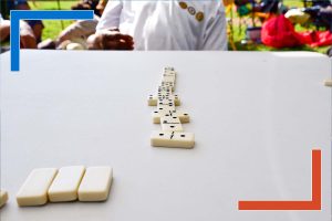 Row of dominoes on a table symbolizing connected data and decision chains enabled by Tableau developers for executive insights.